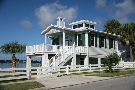 house on bay with impact hurricane coastal windows